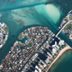 An aerial shot north of Miami showing islands filled with houses, apartments, and other buildings.